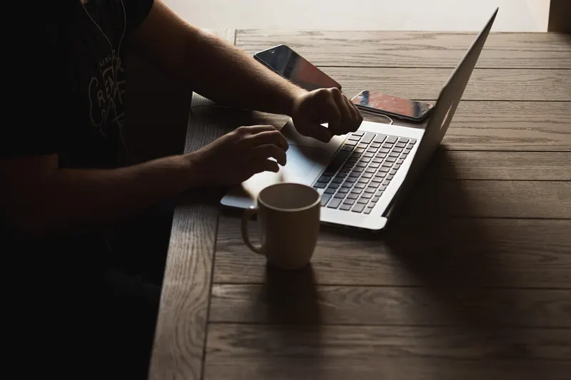 Team member reviewing wireless plan documents at a conference table