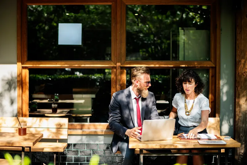 Business owner and consultant reviewing a plan together